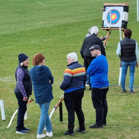 group of ponteland archers with target in background