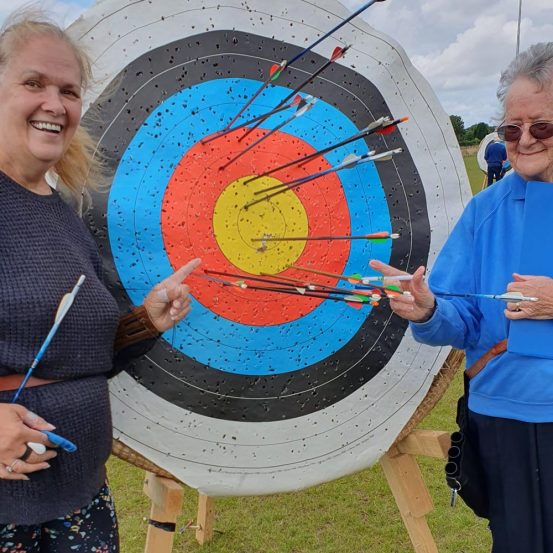 Female Ponteland Archers scoring gold on the target